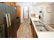 Eat-in kitchen featuring stainless steel appliances and light tile floors at 840 Brandy Oaks Ln, Stone Mountain, GA 30088