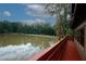 Deck overlooking a serene lake at 840 Brandy Oaks Ln, Stone Mountain, GA 30088