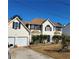 Two-story house with attached garage and landscaping at 4769 Snap Creek Ln, Decatur, GA 30035