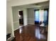 Open dining room with hardwood floors and kitchen view at 4769 Snap Creek Ln, Decatur, GA 30035