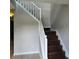 Image of a staircase with white railings and dark wood steps at 4769 Snap Creek Ln, Decatur, GA 30035