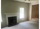 Living room features a fireplace and neutral carpeting at 4769 Snap Creek Ln, Decatur, GA 30035