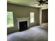 Living room with fireplace and neutral carpeting at 4769 Snap Creek Ln, Decatur, GA 30035