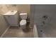 Bathroom features a toilet, sink, and bathtub at 5300 Forest Downs Ln, Atlanta, GA 30349