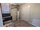 Laundry room with water heater and exterior door at 5300 Forest Downs Ln, Atlanta, GA 30349