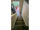 Carpeted stairs leading to the entrance with a small deck at 5300 Forest Downs Ln, Atlanta, GA 30349