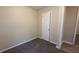 Simple bedroom with carpet, neutral walls and door to closet at 5300 Forest Downs Ln, Atlanta, GA 30349