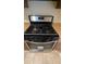 Stainless steel freestanding oven with gas cooktop at 5300 Forest Downs Ln, Atlanta, GA 30349