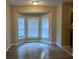 Dining room features hardwood floors and a bay window at 5300 Forest Downs Ln, Atlanta, GA 30349
