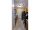 Galley kitchen with stainless steel appliances and tile floors at 5300 Forest Downs Ln, Atlanta, GA 30349