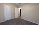 Bright bedroom with neutral walls, carpet, and two closets at 5300 Forest Downs Ln, Atlanta, GA 30349