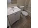 Clean bathroom with white vanity, toilet, and bathtub at 5300 Forest Downs Ln, Atlanta, GA 30349