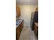 Kitchen features stainless steel refrigerator and tile floor at 5300 Forest Downs Ln, Atlanta, GA 30349