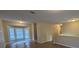 Open living room with hardwood floors and bay windows at 5300 Forest Downs Ln, Atlanta, GA 30349