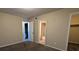 Bright bedroom with carpet, access to bathroom and walk-in closet at 5300 Forest Downs Ln, Atlanta, GA 30349