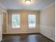 Bright dining room with hardwood floors and wainscoting at 2097 Kolb Ridge Sw Ct, Marietta, GA 30008