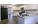 Eat-in kitchen with granite countertops, stainless steel appliances, and an island at 2097 Kolb Ridge Sw Ct, Marietta, GA 30008