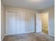 Spacious bedroom with double doors leading to a staircase at 2097 Kolb Ridge Sw Ct, Marietta, GA 30008