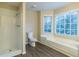 Bathroom boasts a shower, bathtub, and modern flooring at 2097 Kolb Ridge Sw Ct, Marietta, GA 30008
