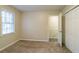 Bright bedroom with carpet flooring and two windows at 2097 Kolb Ridge Sw Ct, Marietta, GA 30008