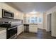 Modern kitchen with stainless steel appliances and granite countertops at 2097 Kolb Ridge Sw Ct, Marietta, GA 30008