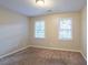 Well-lit bedroom with carpet flooring and two windows at 2097 Kolb Ridge Sw Ct, Marietta, GA 30008