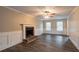 Spacious living room featuring a brick fireplace and hardwood floors at 2097 Kolb Ridge Sw Ct, Marietta, GA 30008