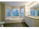 Elegant bathroom with a large soaking tub and double vanity at 2097 Kolb Ridge Sw Ct, Marietta, GA 30008