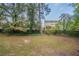 Spacious backyard with mature trees and wooden fence at 2097 Kolb Ridge Sw Ct, Marietta, GA 30008