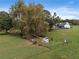 Aerial view showing a house with large backyard and surrounding trees at 4165 Milford Trl, Cumming, GA 30028