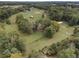Aerial view of property highlighting home, outbuildings and surrounding land at 4165 Milford Trl, Cumming, GA 30028