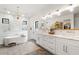 Spa-like bathroom with a soaking tub, double vanity, and walk-in shower at 4165 Milford Trl, Cumming, GA 30028