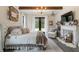 Bright and airy bedroom featuring a fireplace and plenty of natural light at 4165 Milford Trl, Cumming, GA 30028