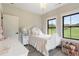 Light and airy bedroom with white furniture and a tranquil feel at 4165 Milford Trl, Cumming, GA 30028