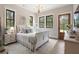 Cozy bedroom with white sleigh bed, wood flooring and access to private bathroom at 4165 Milford Trl, Cumming, GA 30028