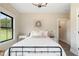 Charming bedroom with a metal bed frame and rustic decor at 4165 Milford Trl, Cumming, GA 30028