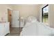 Cozy bedroom with white furniture and a large window at 4165 Milford Trl, Cumming, GA 30028