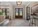 Elegant entryway with herringbone flooring and French doors at 4165 Milford Trl, Cumming, GA 30028