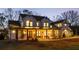 Stunning two-story farmhouse with a large front porch and expansive lawn at 4165 Milford Trl, Cumming, GA 30028