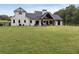 Modern farmhouse exterior with large backyard at 4165 Milford Trl, Cumming, GA 30028