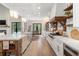 Spacious kitchen with white cabinets, marble countertops, and a farmhouse sink at 4165 Milford Trl, Cumming, GA 30028