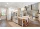 Open concept kitchen with a large island and stainless steel appliances at 4165 Milford Trl, Cumming, GA 30028