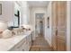 Bright kitchen boasts a farmhouse sink, marble countertops, and a spacious pantry at 4165 Milford Trl, Cumming, GA 30028