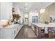 Spacious kitchen with island, stainless steel appliances, and white cabinets at 4165 Milford Trl, Cumming, GA 30028