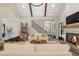 Open living room showcasing a cozy fireplace, high ceilings, and ample natural light at 4165 Milford Trl, Cumming, GA 30028