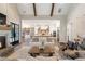 Open concept living room with kitchen access and a stunning fireplace at 4165 Milford Trl, Cumming, GA 30028