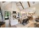 Spacious living room with vaulted ceilings, a large fireplace, and plenty of natural light at 4165 Milford Trl, Cumming, GA 30028