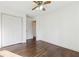 Spacious bedroom featuring hardwood floors, white walls, and double doors closet at 5051 Heather Se Rd, Smyrna, GA 30082