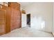 Unfurnished bedroom with exposed brick wall, built-in ladder, and unfinished concrete floors at 5051 Heather Se Rd, Smyrna, GA 30082