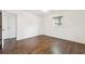 Spacious bedroom with hardwood floors, white walls, and ample natural light at 5051 Heather Se Rd, Smyrna, GA 30082